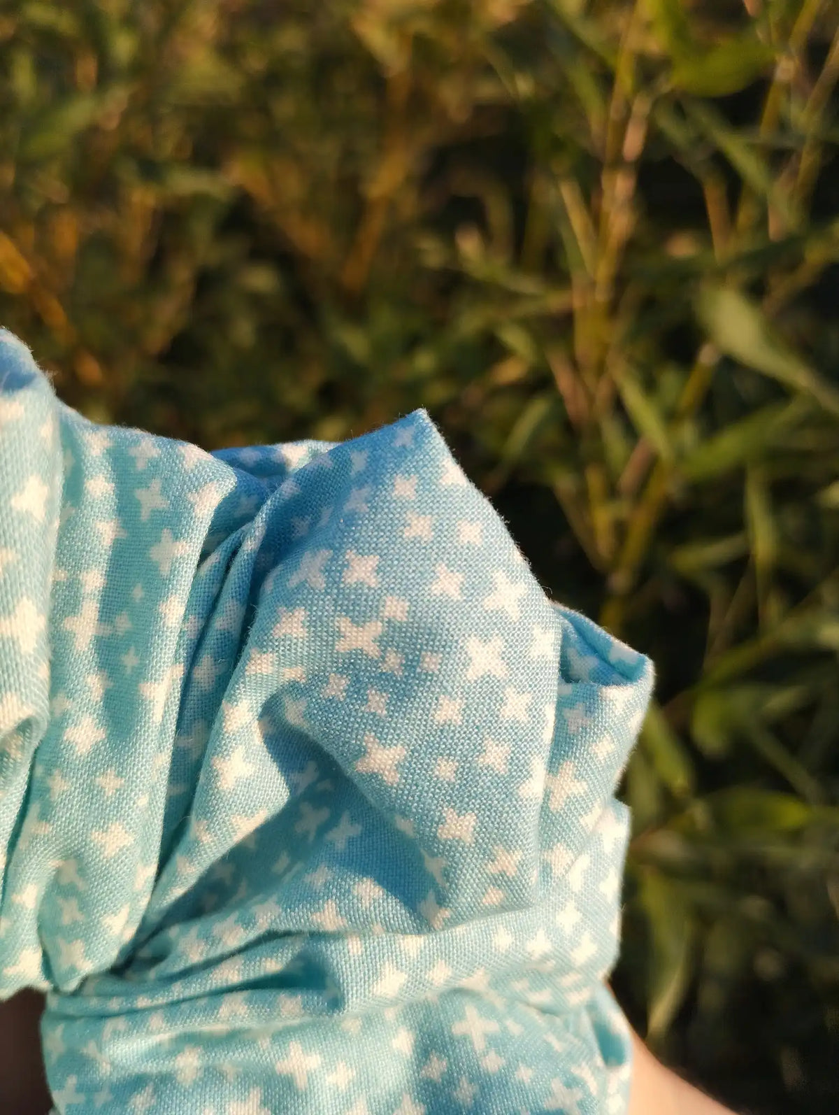 Close-up of the fabric texture and pattern on Aqua Stitch Jumbo Scrunchie