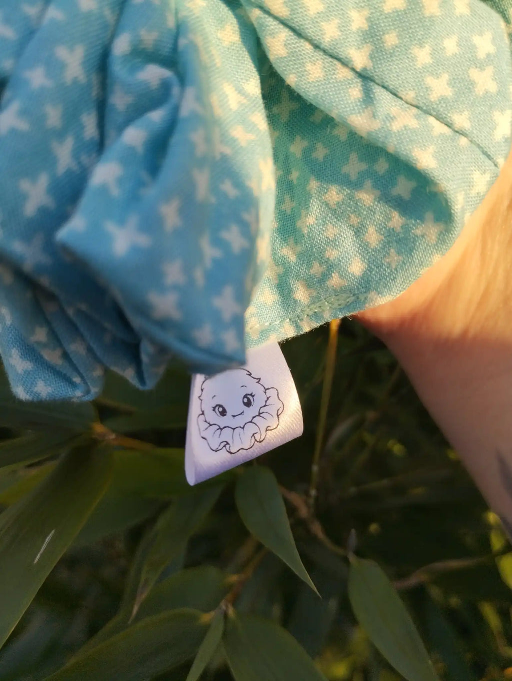 Scrunchlings character label and stitching on Aqua Stitch Jumbo Scrunchie