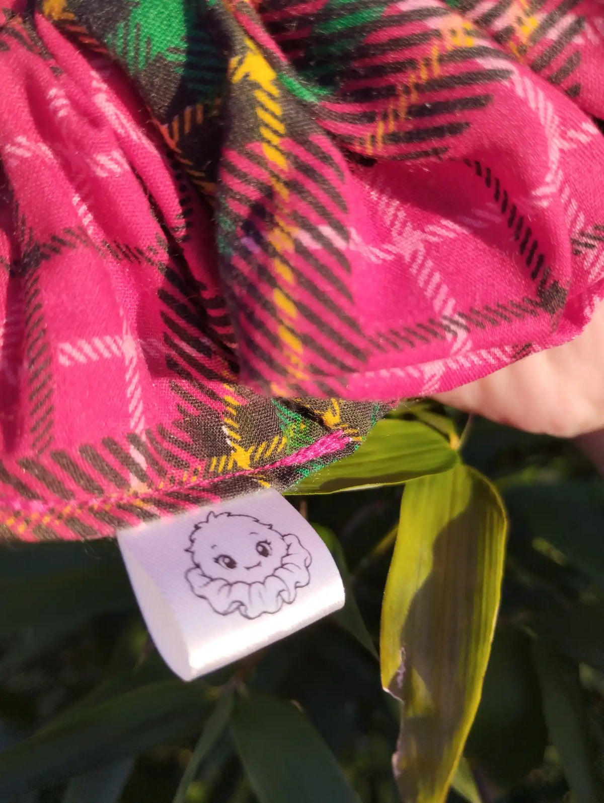 Scrunchlings character label and stitching on Berry Tartan Jumbo Scrunchie