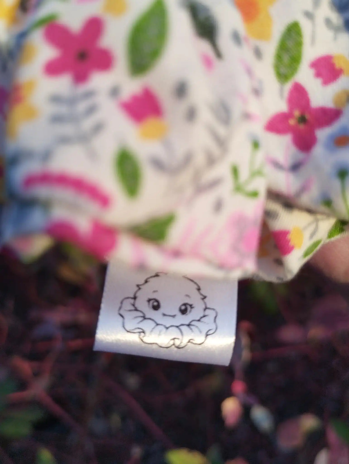 Scrunchlings character label and stitching on Blossom Meadow Jumbo Scrunchie