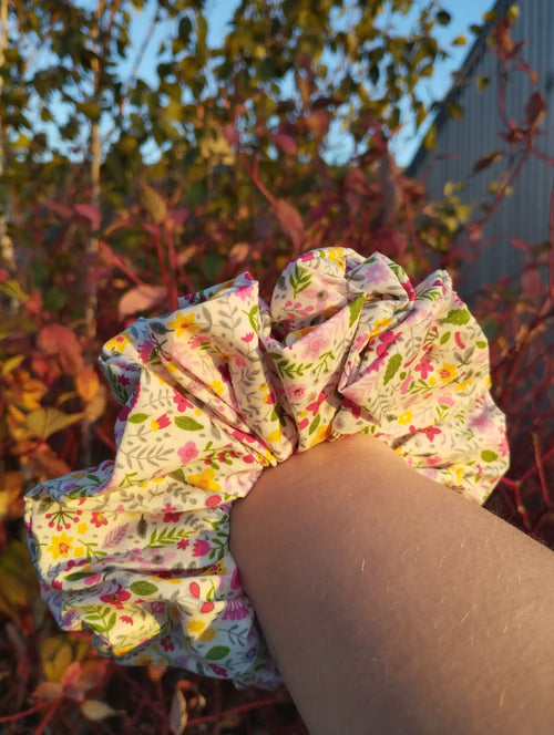 Blossom Meadow Jumbo Scrunchie worn on a wrist to show its size