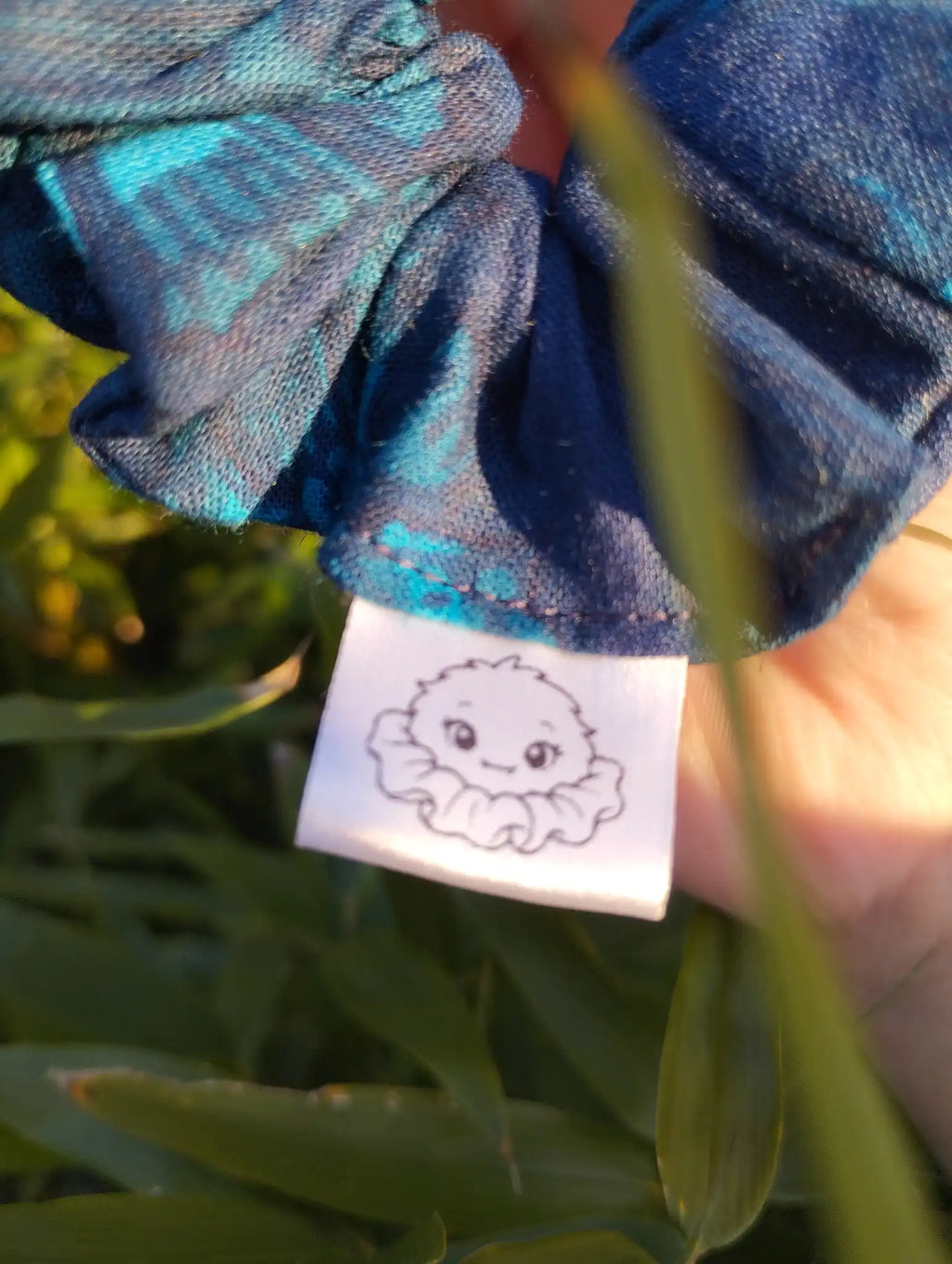 Scrunchlings character label and stitching on Blue Garden Medium Scrunchie