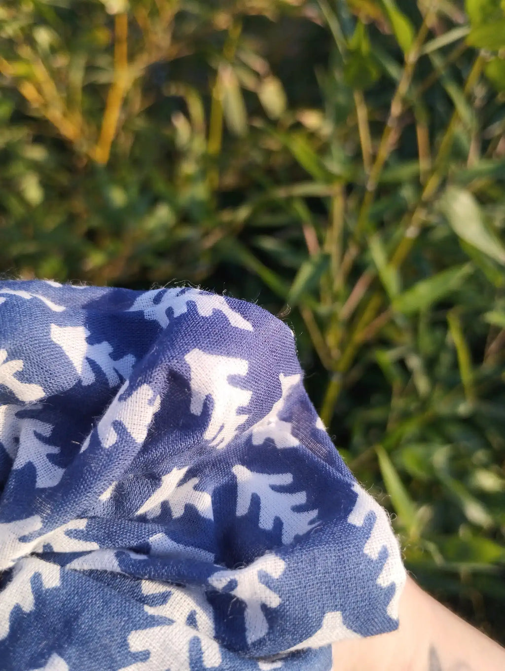 Close-up of the fabric texture and pattern on Blue Leaf Jumbo Scrunchie