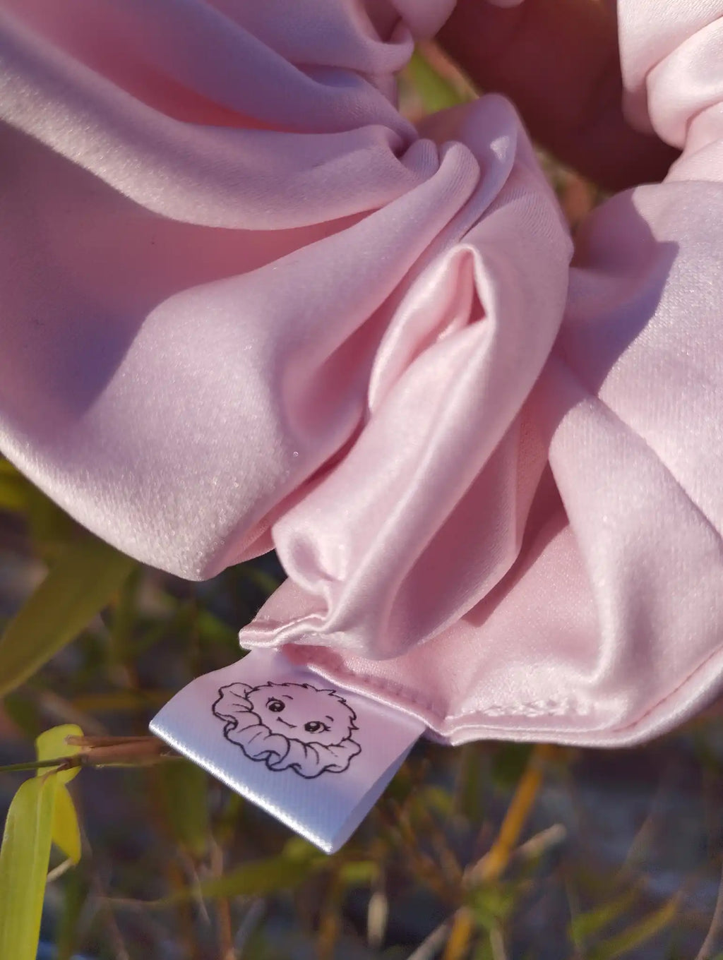 Scrunchlings character label and stitching on Blush Pink satin Jumbo scrunchie