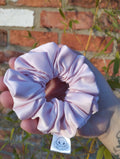Blush Pink satin Medium scrunchie showing its gathered shape