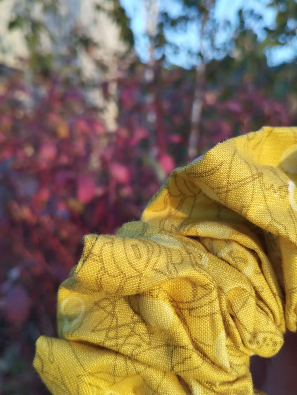 Close-up of the fabric texture and pattern on Buttercup Jumbo Scrunchie