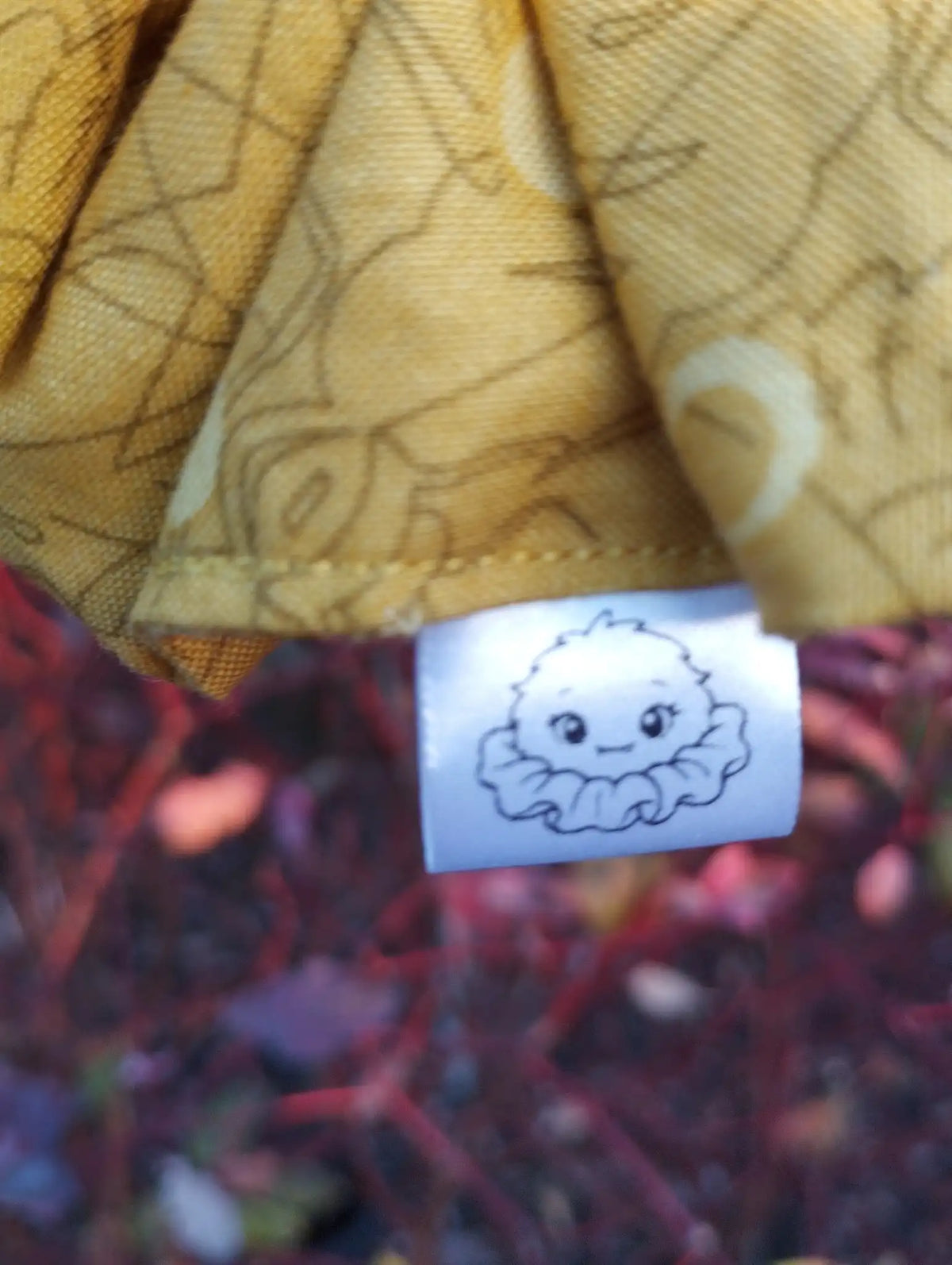 Scrunchlings character label and stitching on Buttercup Jumbo Scrunchie