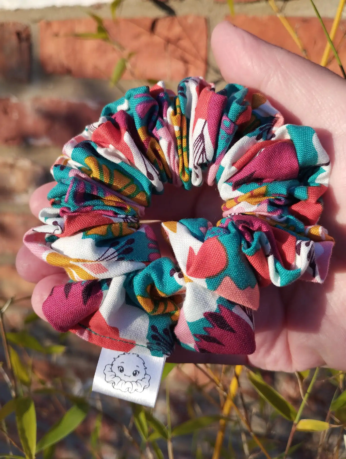 Carnival Bloom cotton Medium scrunchie showing its gathered shape