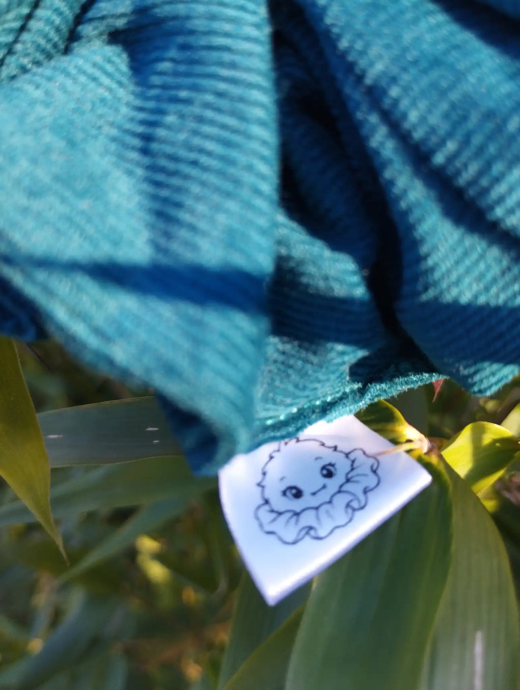 Scrunchlings character label and stitching on Deep Teal Jumbo Scrunchie