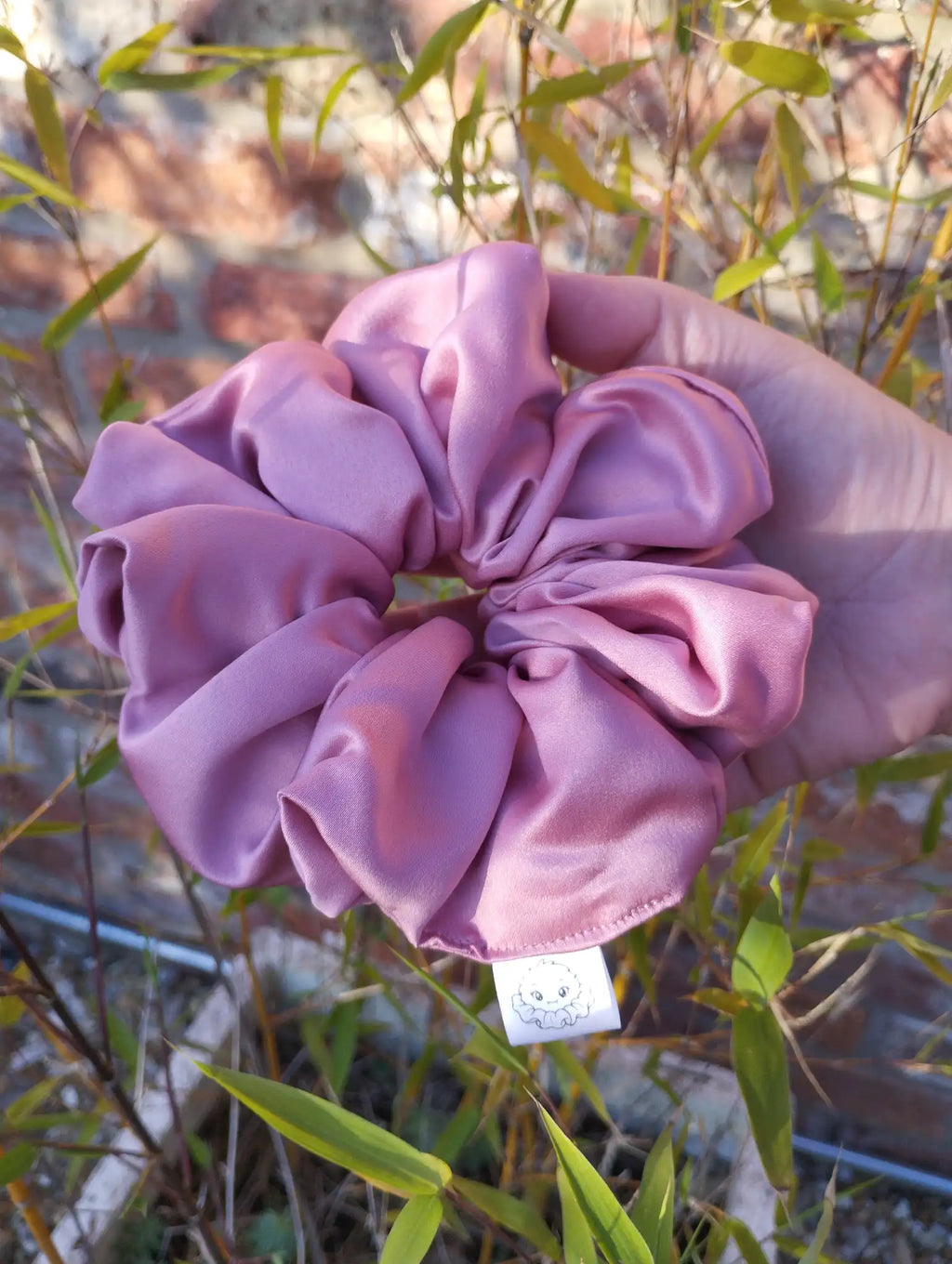 Dusky Rose satin Jumbo scrunchie showing its full gathered shape