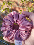 Dusky Rose satin Medium scrunchie showing its gathered shape