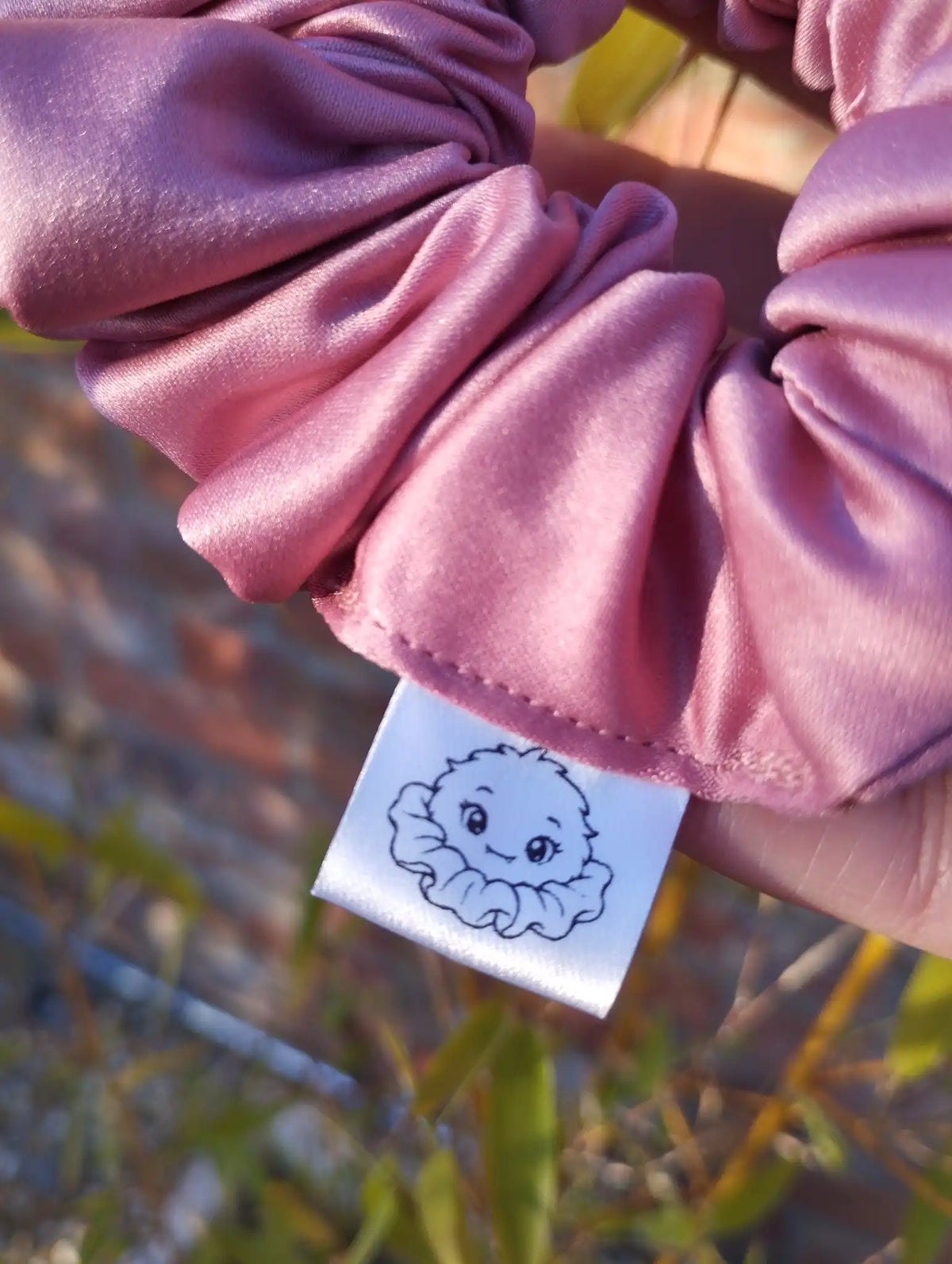 Scrunchlings character label and stitching on Dusky Rose satin Medium scrunchie