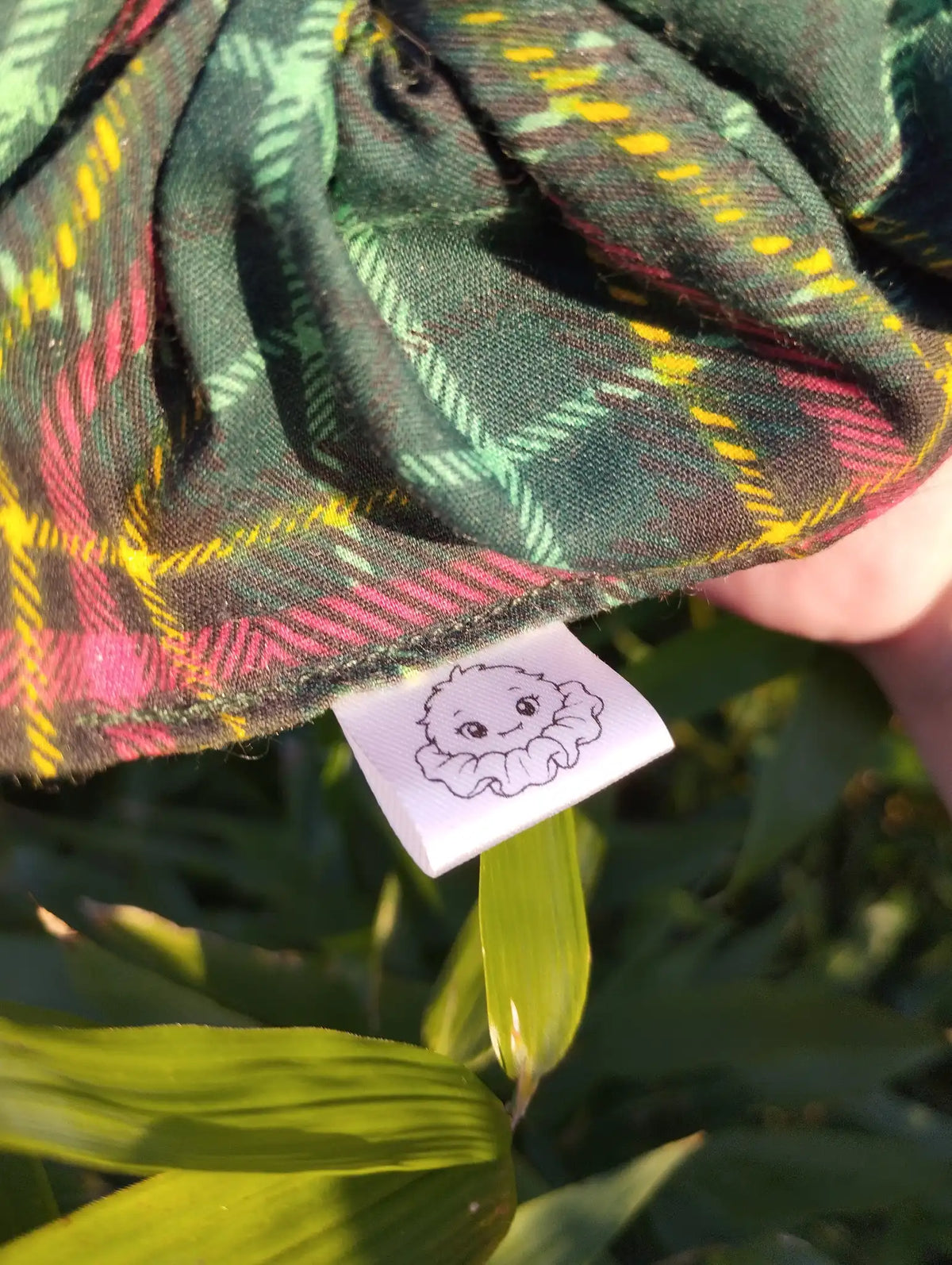 Scrunchlings character label and stitching on Forest Tartan Jumbo Scrunchie