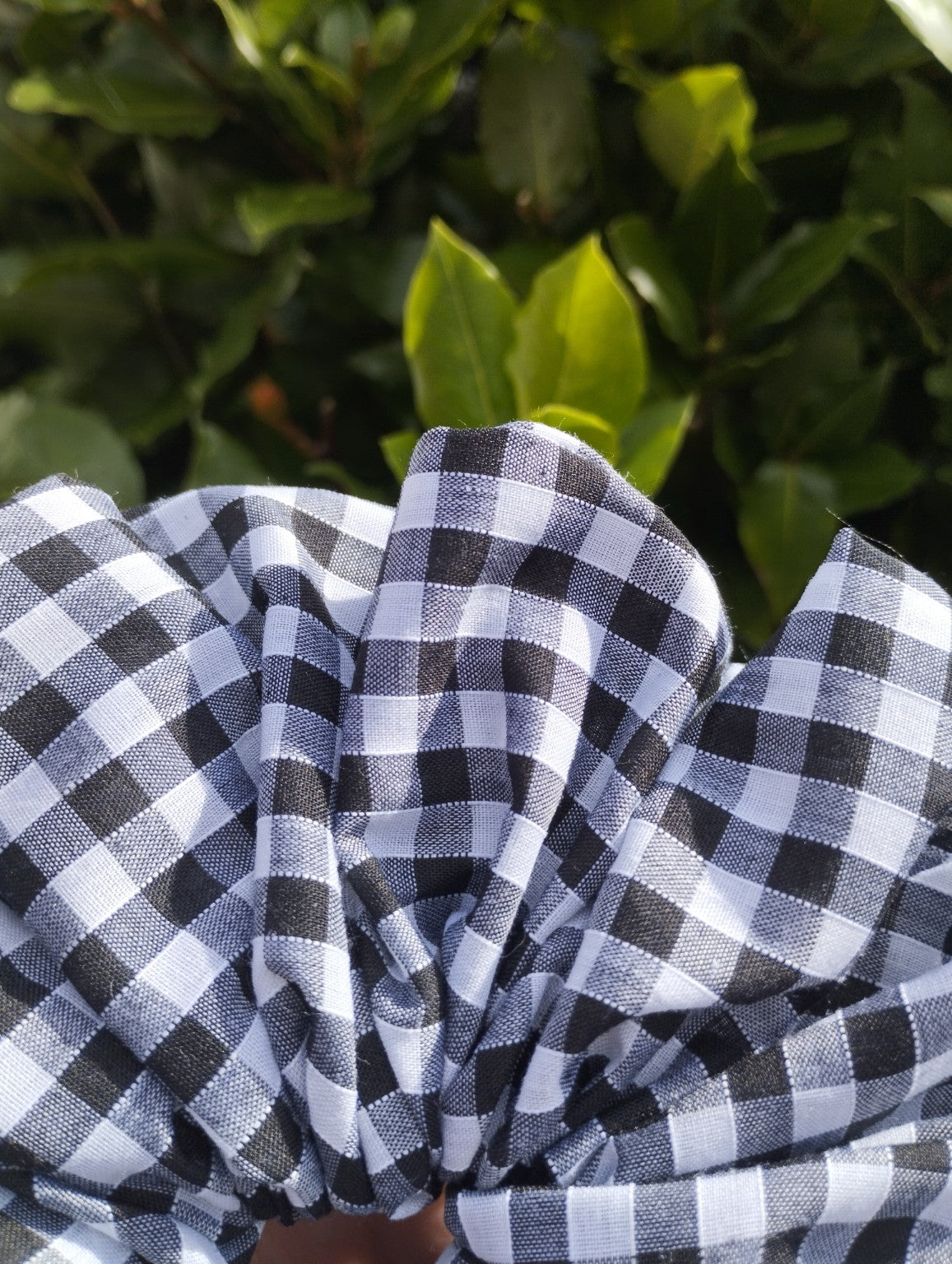Close-up of black and white gingham fabric on Midnight Gingham Super Jumbo scrunchie