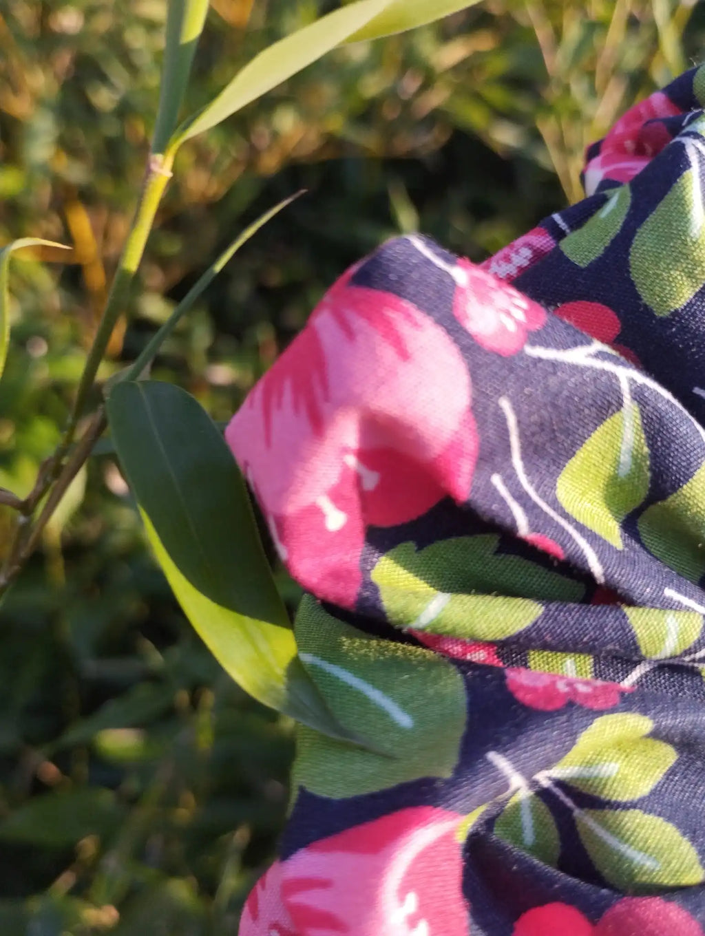 Close-up of the fabric texture and pattern on Midnight Poppies Jumbo Scrunchie