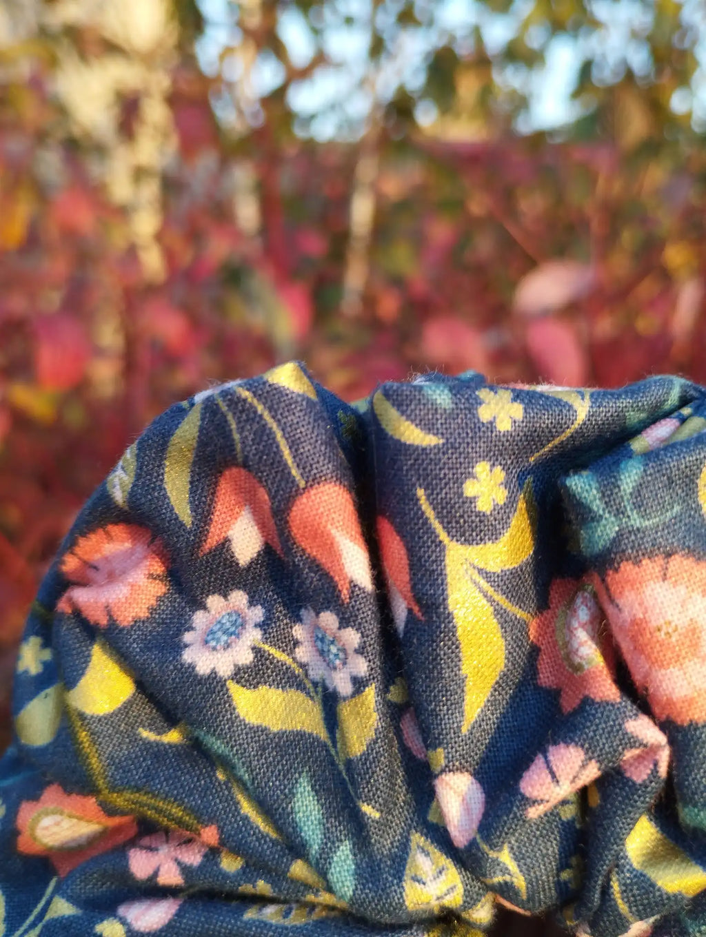 Close-up of the fabric texture and pattern on Navy Posy Jumbo Scrunchie