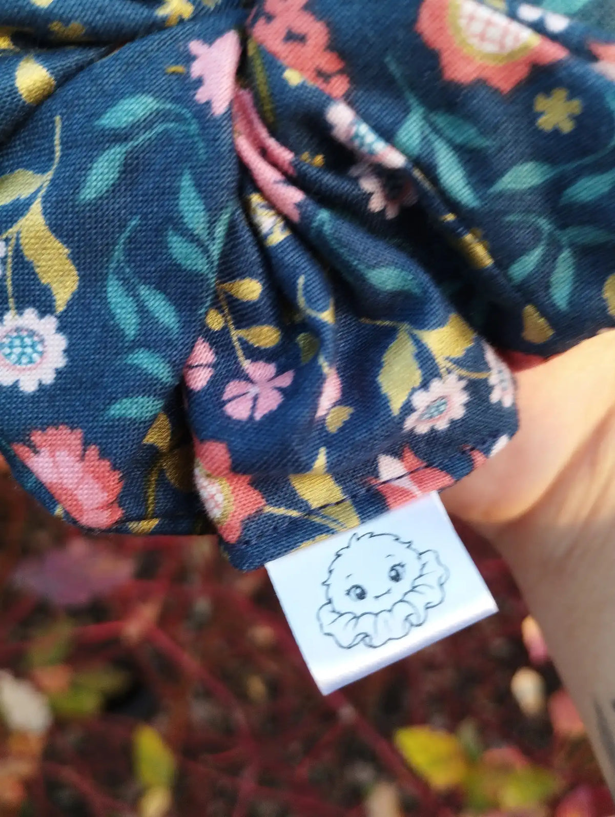 Scrunchlings character label and stitching on Navy Posy Jumbo Scrunchie