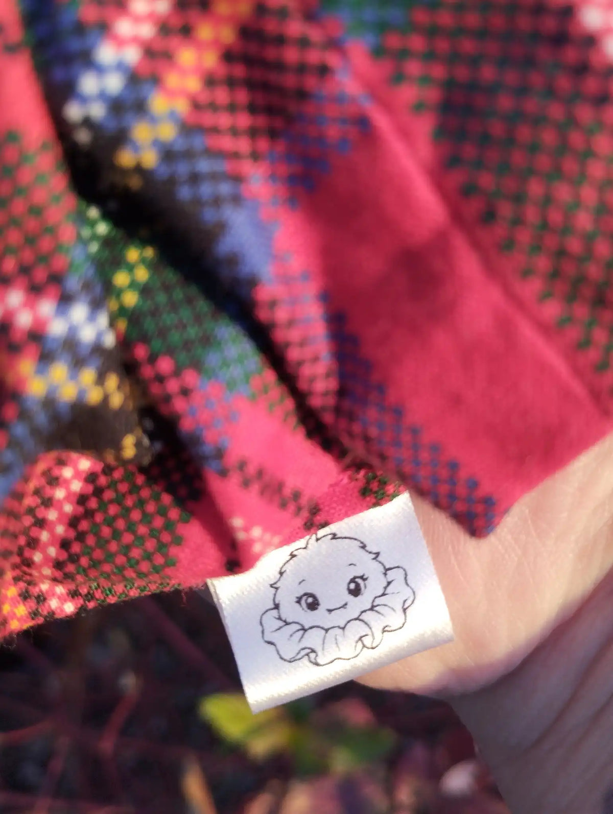 Scrunchlings character label and stitching on Red Tartan Jumbo Scrunchie