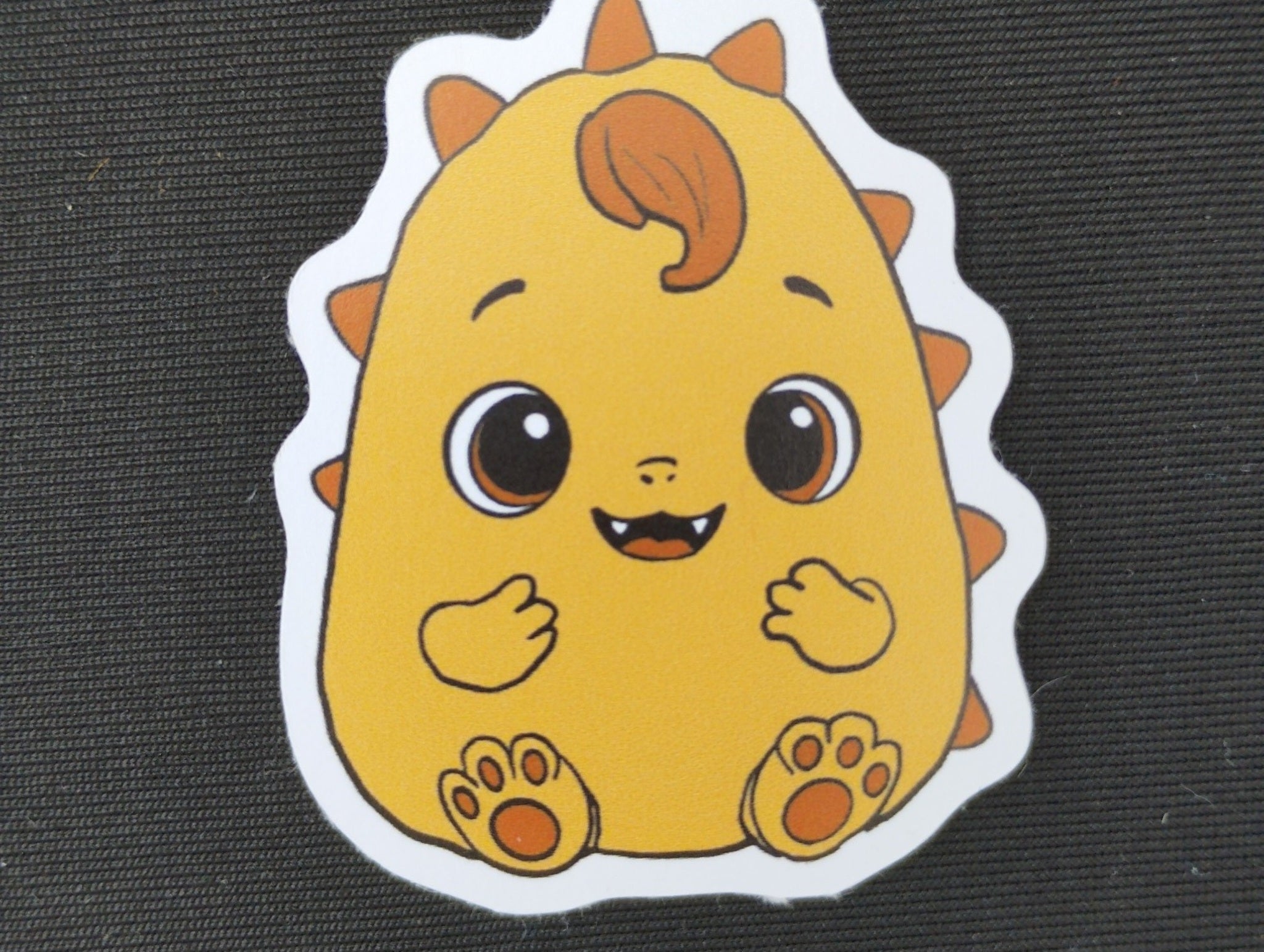 Pebble orange Scrunchlings character sticker