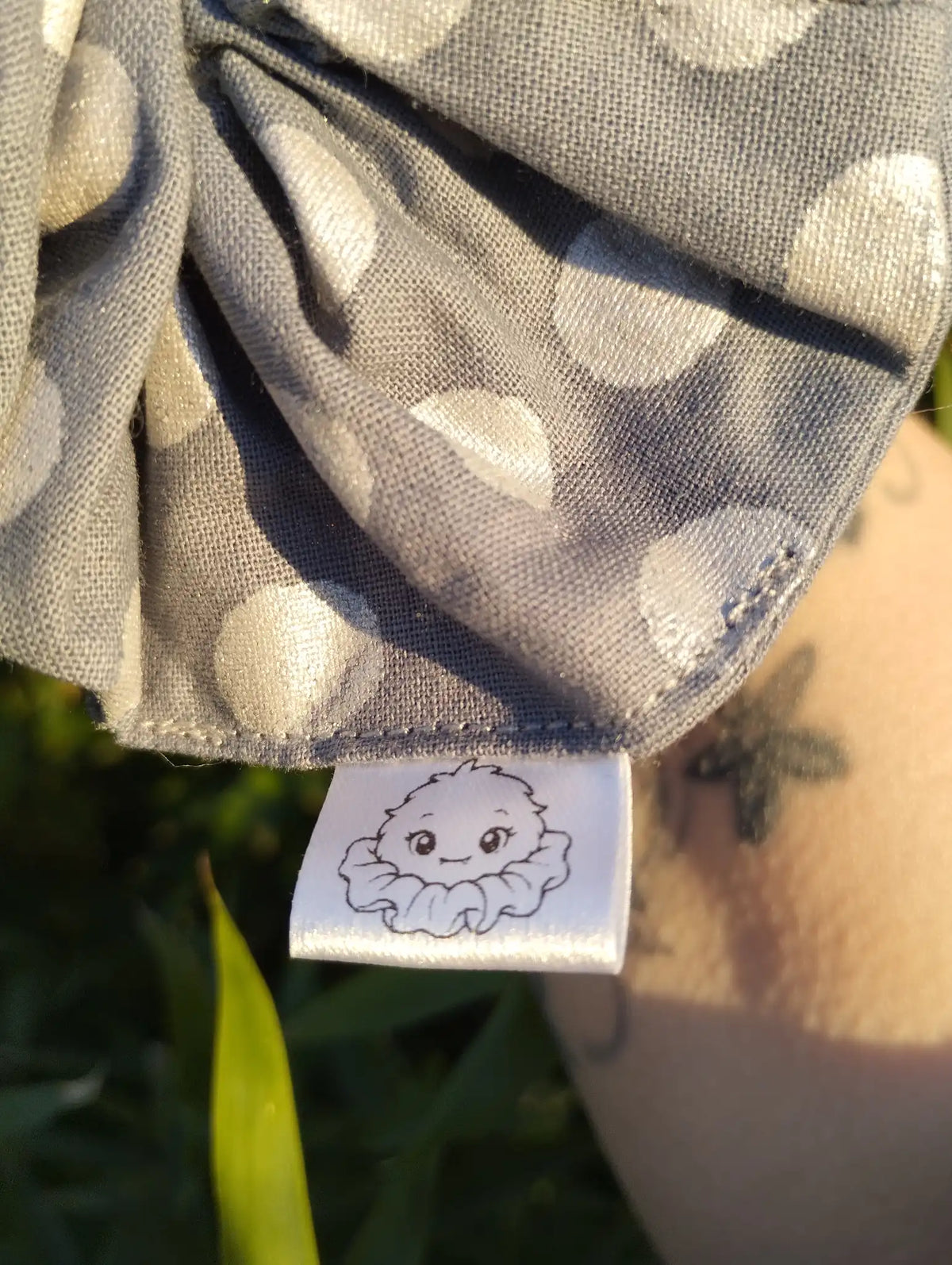 Scrunchlings character label and stitching on Silver Spot Jumbo Scrunchie