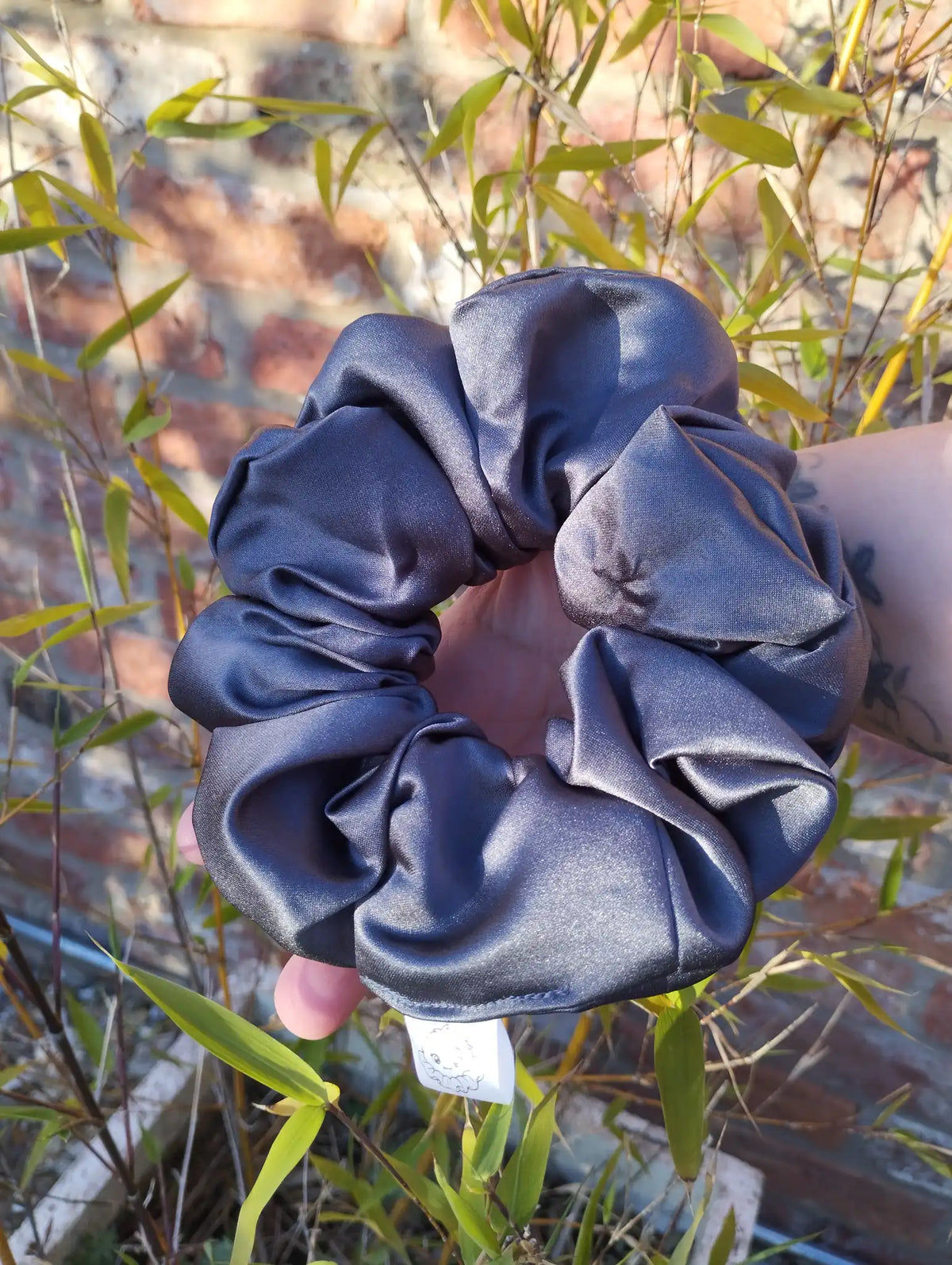 Slate Grey satin Jumbo scrunchie showing its full gathered shape