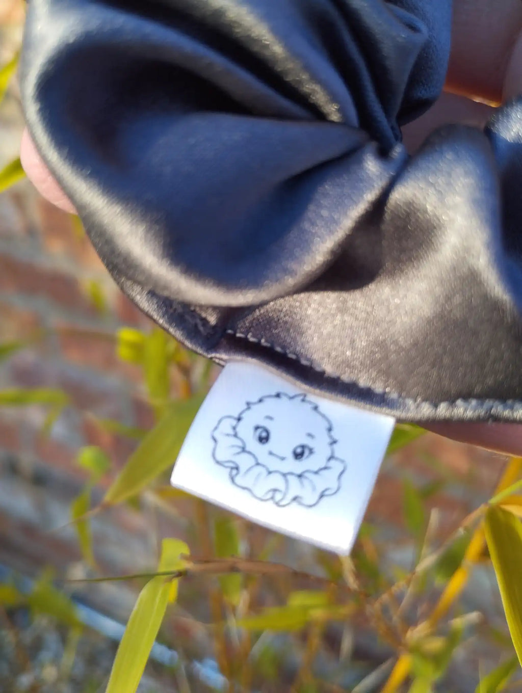 Scrunchlings character label and stitching on Slate Grey satin Medium scrunchie