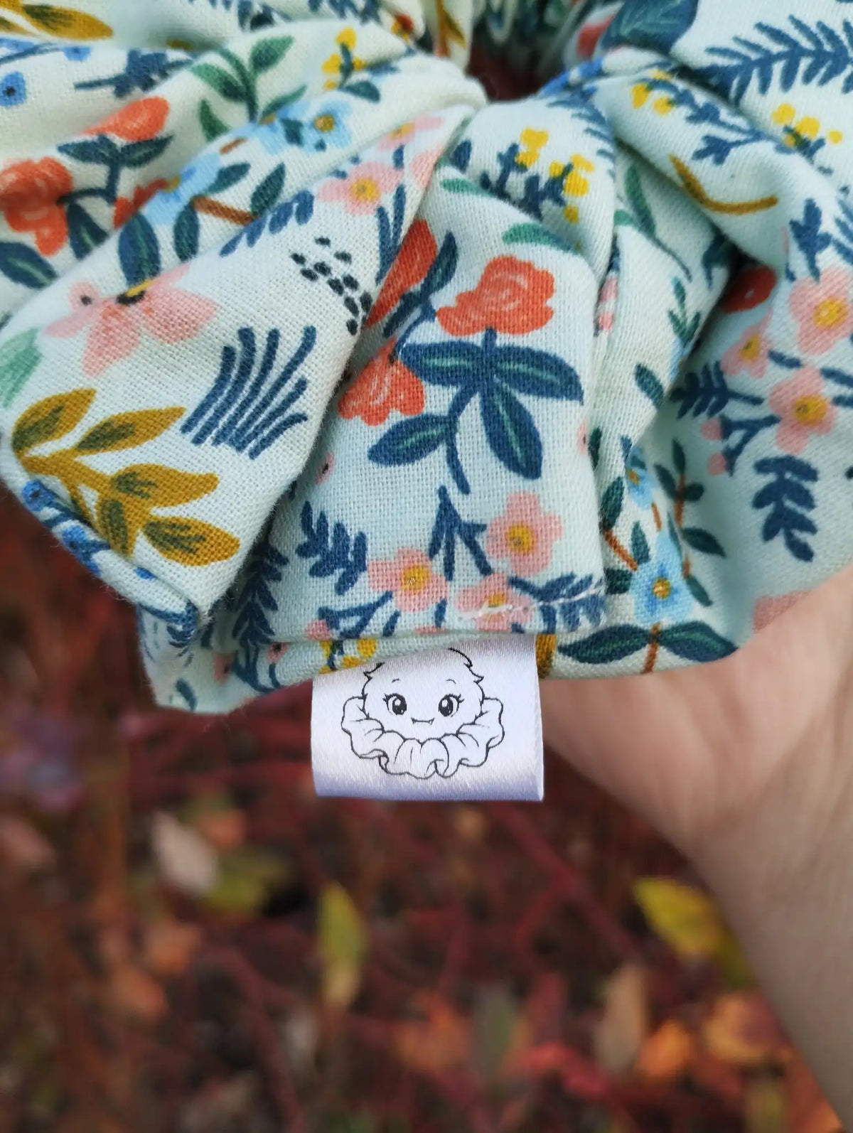 Scrunchlings character label and stitching on Soft Meadow Jumbo Scrunchie