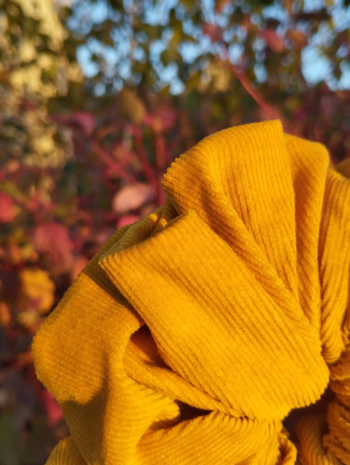 Close-up of the fabric texture and pattern on Sunflower Gold Jumbo Scrunchie