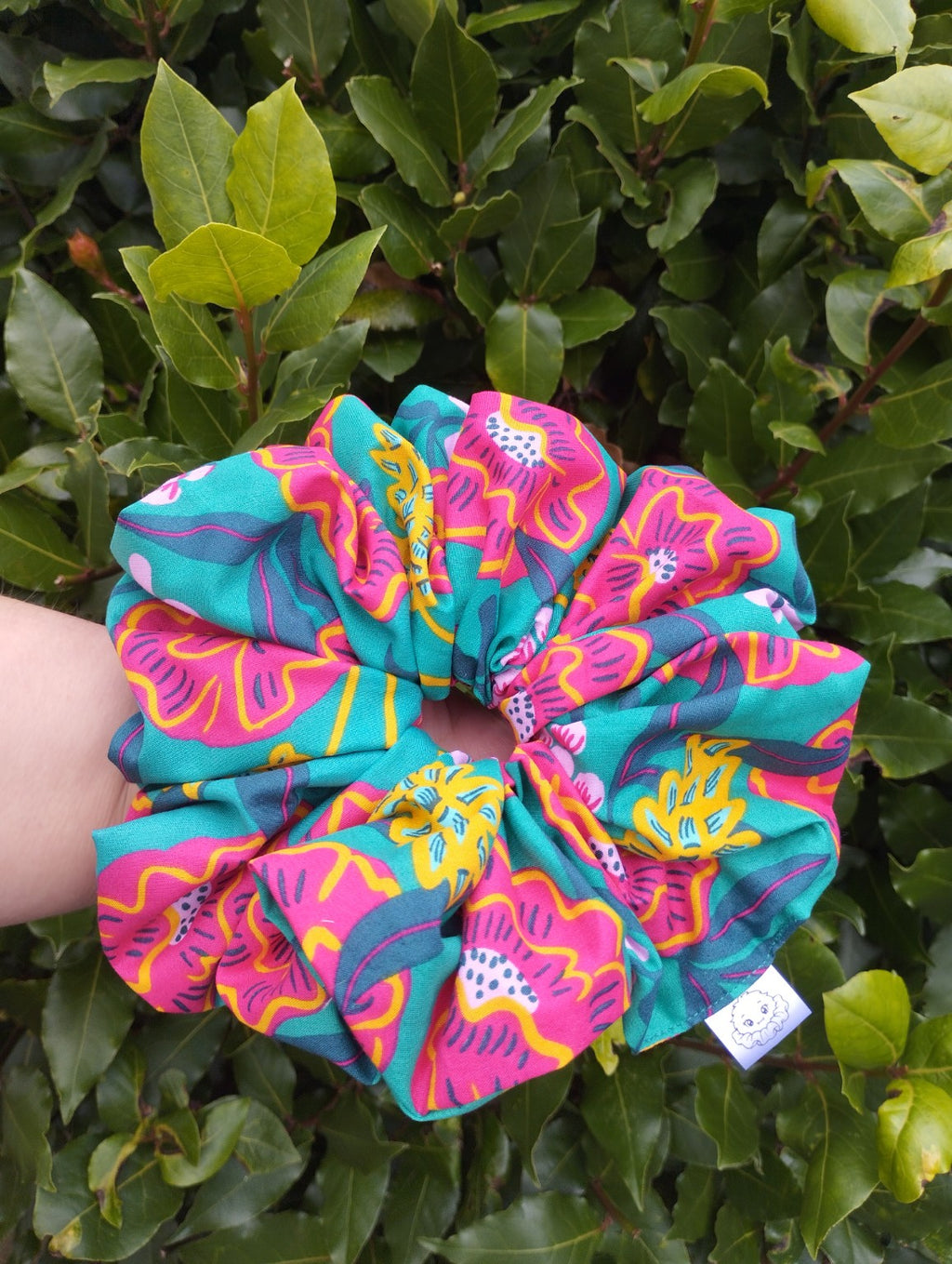 Tropical Bloom Super Jumbo scrunchie with teal, pink and yellow floral print, front view