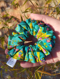 Tropical Kaleidoscope cotton Medium scrunchie showing its gathered shape