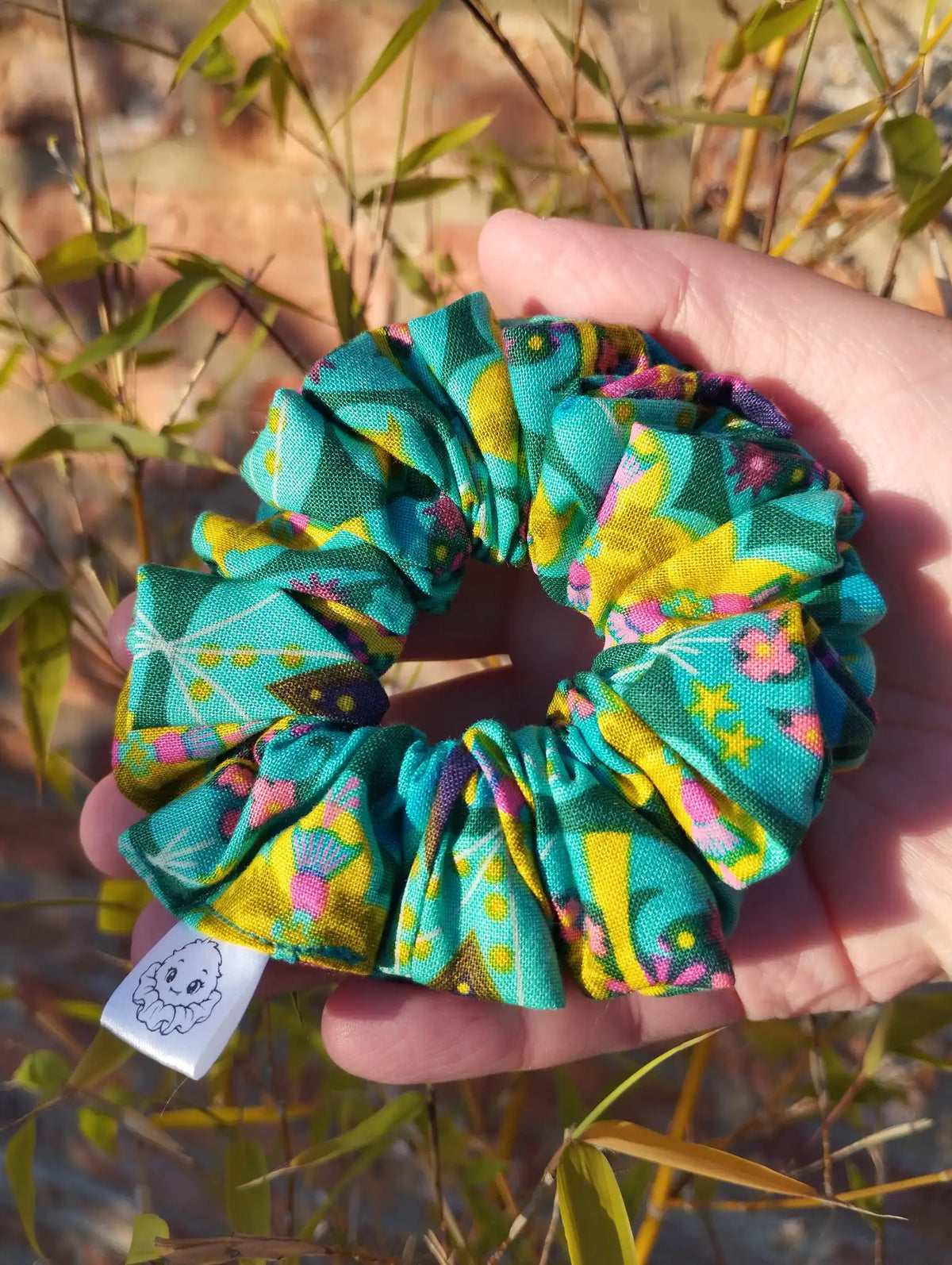 Tropical Kaleidoscope cotton Medium scrunchie showing its gathered shape
