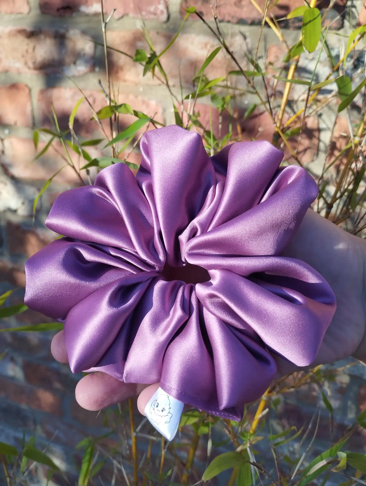 Wild Plum satin Jumbo scrunchie showing its full gathered shape