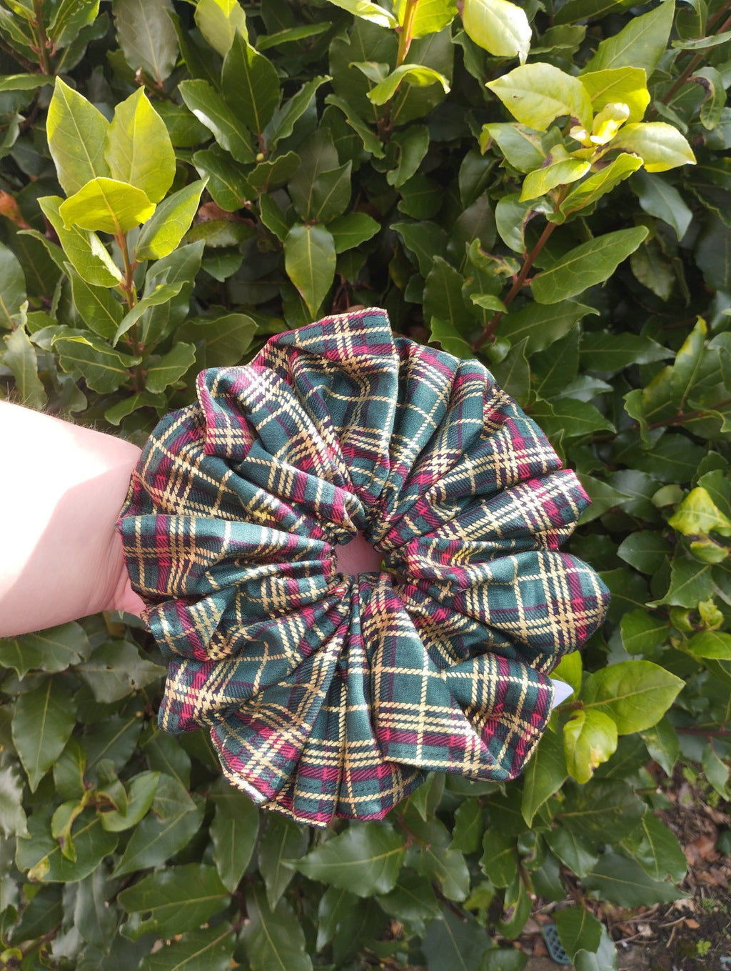 Woodland Tartan Super Jumbo scrunchie with green, burgundy and gold-coloured checks, front view