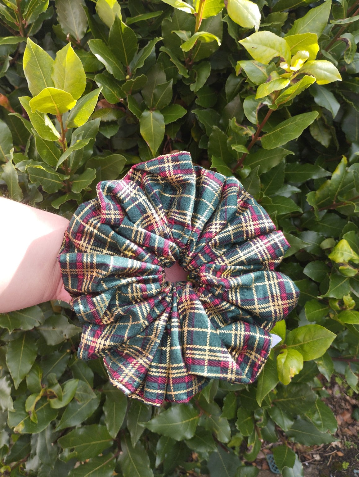Woodland Tartan Super Jumbo scrunchie with green, burgundy and gold-coloured checks, front view