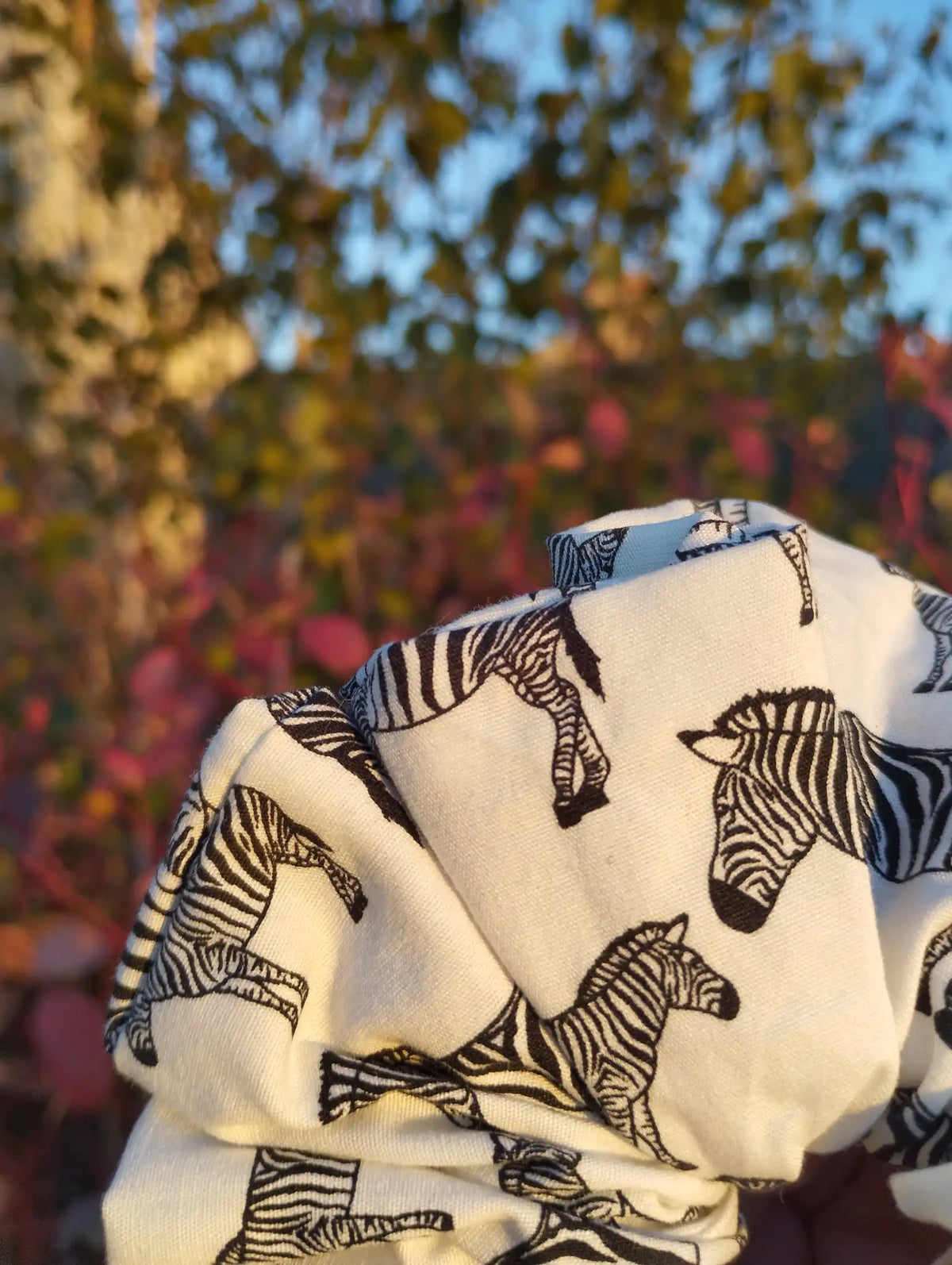 Close-up of the fabric texture and pattern on Zebra Parade Jumbo Scrunchie