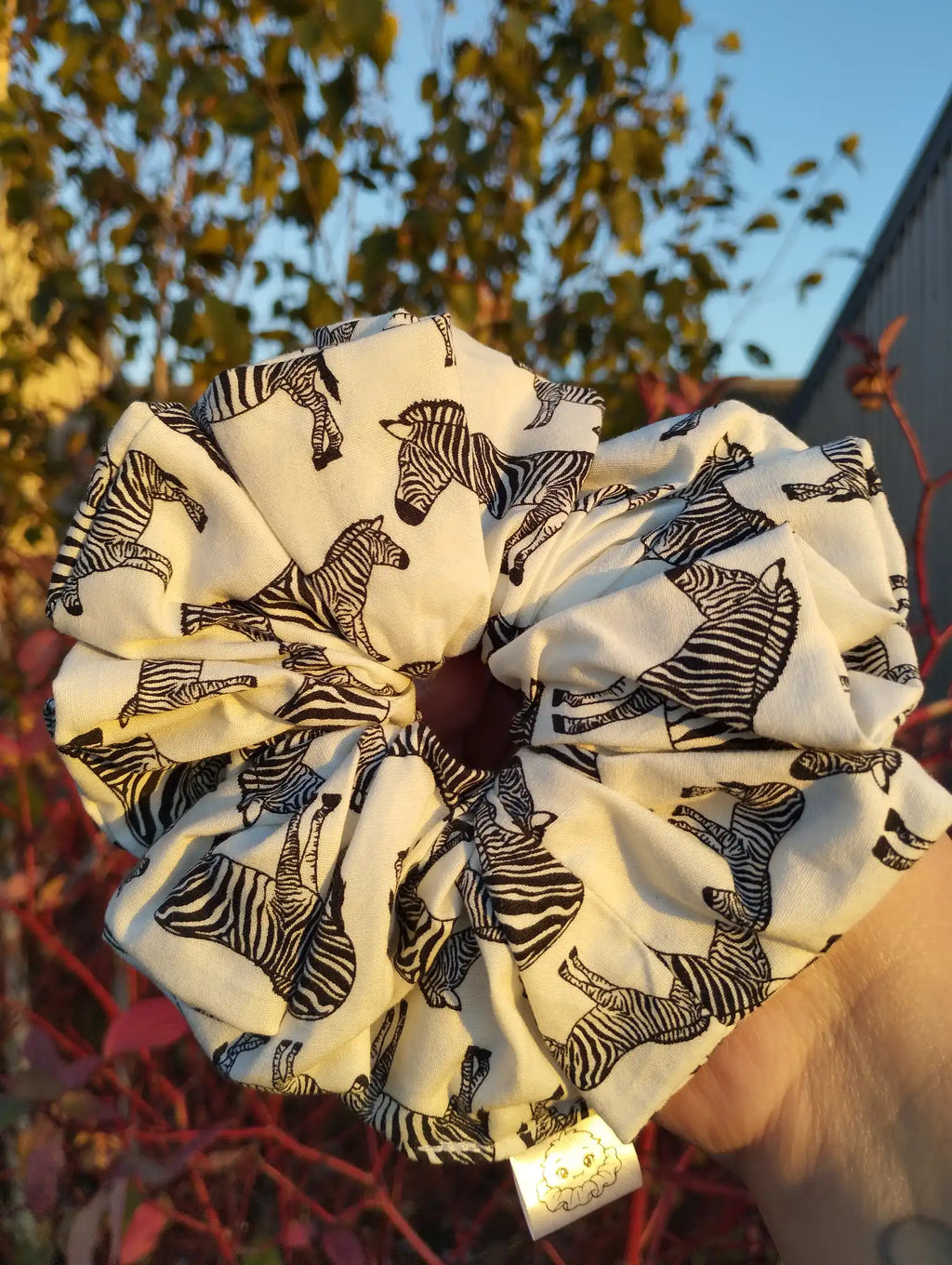 Zebra Parade Jumbo Scrunchie, front view showing the gathered shape